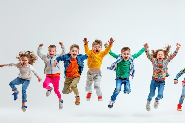 Photo jubilant childrens group celebration excited kids in colorful outfits jumping in the air