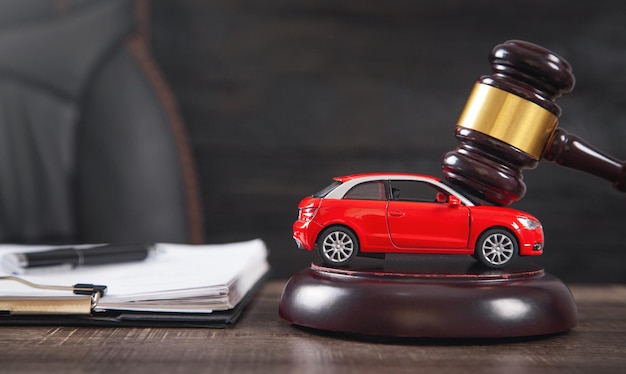 Judge gavel over car and document Car auction