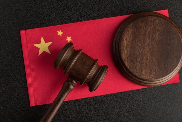 Judge gavel on the China flag Law and legality in PRC Violation of human rights