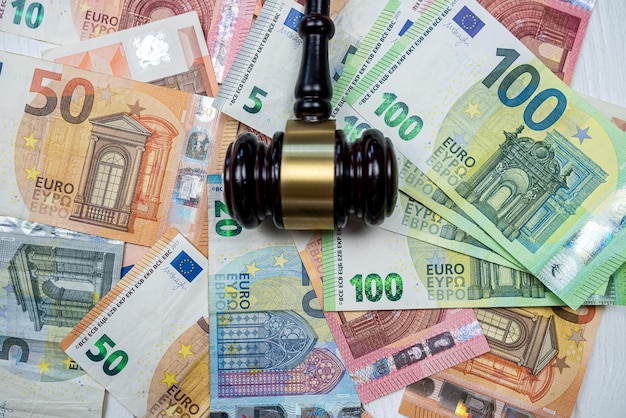 Judge hammer above euro banknotes money Bribe concept