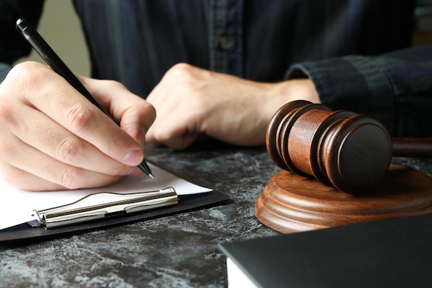 Judge make notes in clipboard, law concept, close up