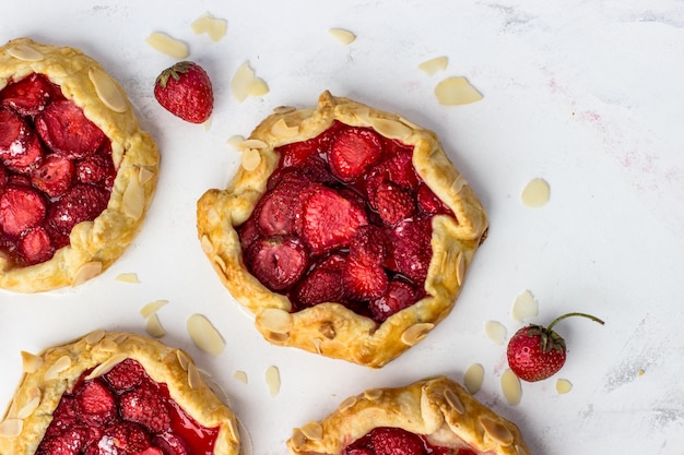 Juicy delicious postcard with strawberry miniscutters Top view of berry portion pies