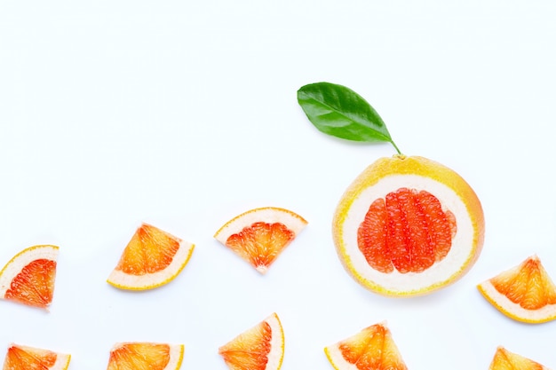 Juicy grapefruit slices with green leaves