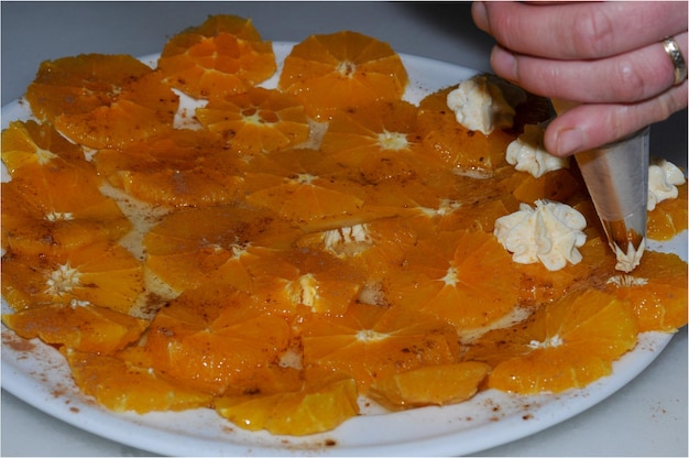 Juicy orange slices flavored with sugar and cinnamon and fresh cheese