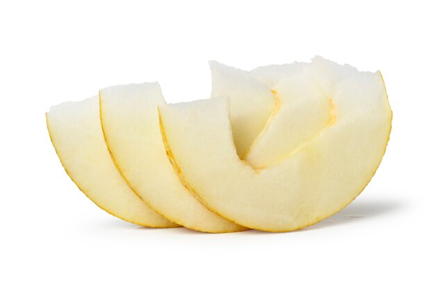 Juicy pieces of melon close-up isolated on a white