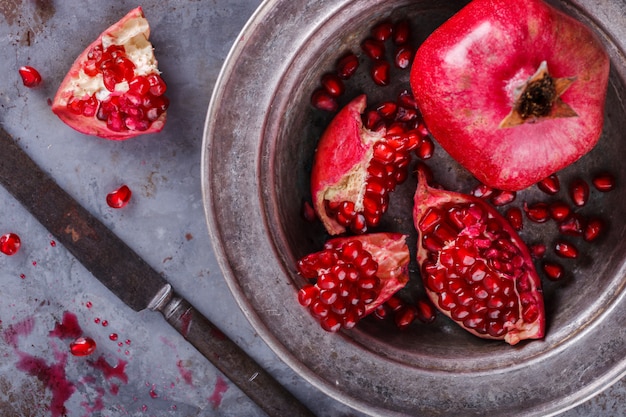 Juicy pomegranates,whole and broken vintage