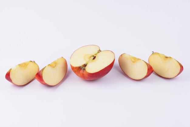 Juicy sweet red apple slices on a light background Healthy food concept Closeup of a red fruit