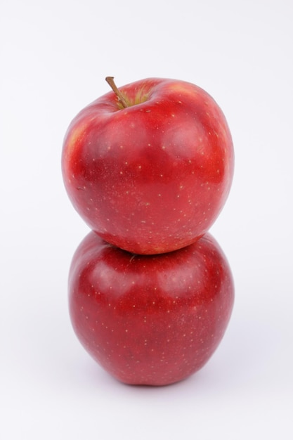 Juicy sweet whole red apple isolated on white background Healthy food concept Closeup of a red fruit