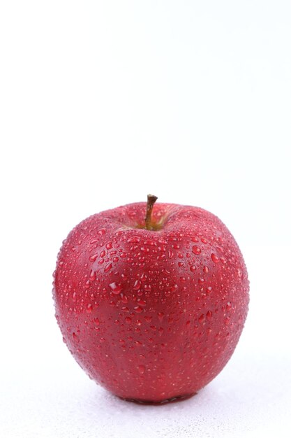 Juicy sweet whole red apple isolated on white background Healthy food concept Closeup of a red fruit