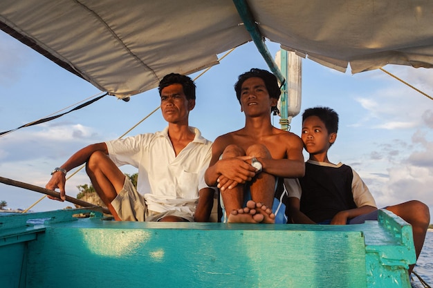 July 07 2009 Boracay Philippines Three young Filipinos on a pleasure boat for tourists