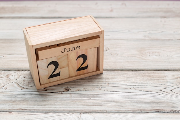 June 22nd. Image of june 22 wooden color calendar on wooden table. Summer day