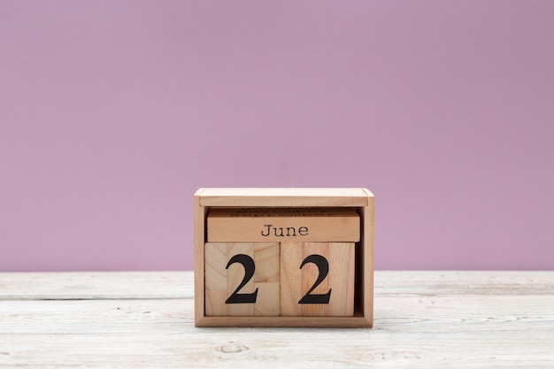 June 22nd. Image of june 22 wooden color calendar on wooden table. Summer day