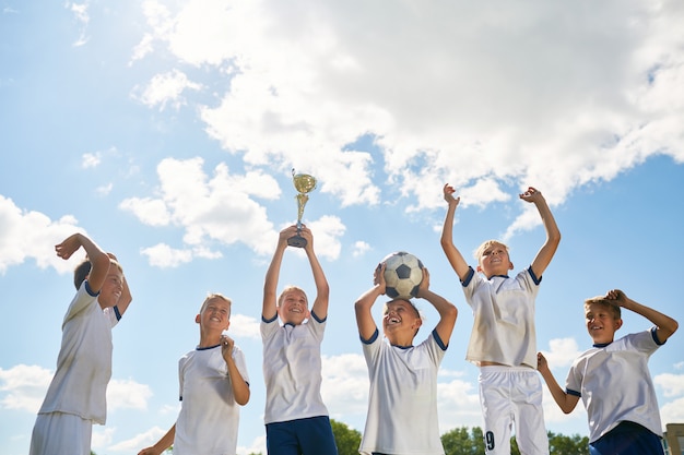 Junior Football Team Celebrating Victory