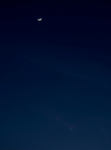 Jupiter and Venus next to the moon in the night sky in Greece