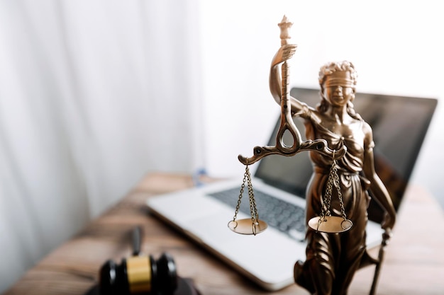 Justice and law conceptMale judge in a courtroom on wooden table and Counselor or Male lawyer working in office Legal law advice and justice concept