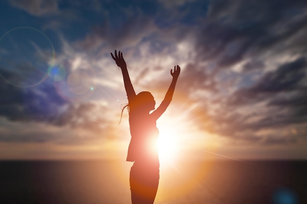 Justice and restorative concept, Silhouette of a healthy woman raised hands