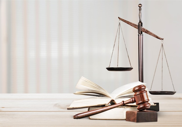 Justice Scales and books and wooden gavel on table. Justice concept