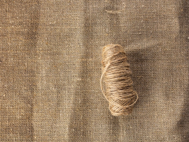 Jute thread on a burlap background as a vintage background