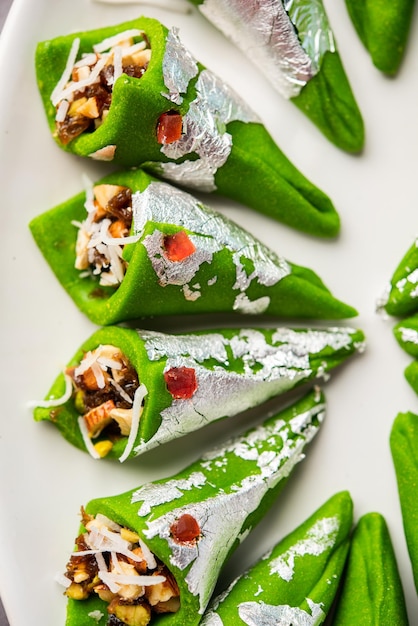 Kaju Gulkand Paan Mithai barfi Indian sweet or dessert served in a plate