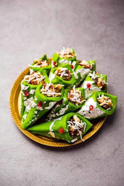 Kaju Gulkand Paan Mithai barfi Indian sweet or dessert served in a plate