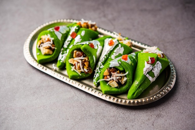 Kaju Gulkand Paan Mithai barfi Indian sweet or dessert served in a plate