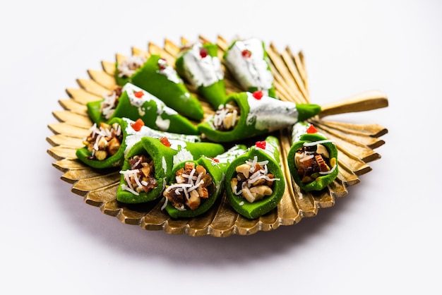 Kaju Gulkand Paan Mithai barfi Indian sweet or dessert served in a plate