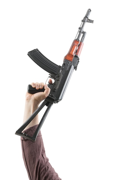 Kalashnikov raised by one hand in a vertical position Isolated