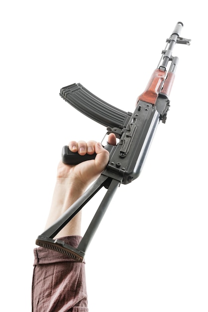 Kalashnikov raised by one hand in a vertical position Isolated