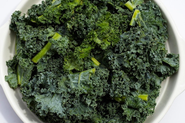 Kale leaves on white background