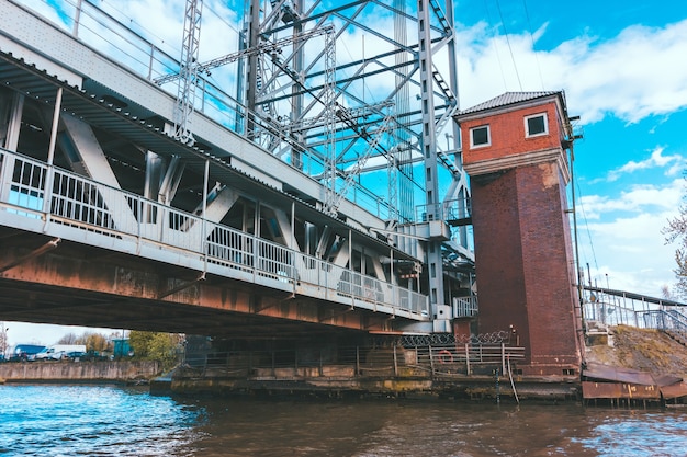 Kaliningrad two-level bridge on a clear day. Brick lookout tower next to the bridge