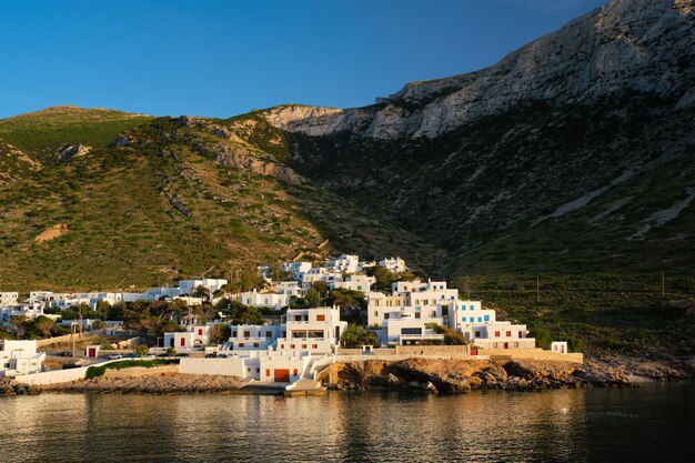 Kamares town with traditional white houses on sifnos island on sunset greece