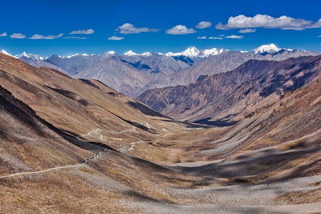 Karakorum range and road in valley Kardung La the highest motorable pass in the world Ladakh India