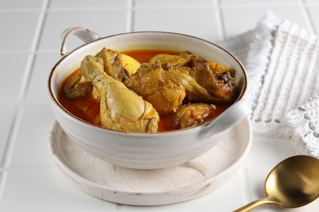 Kari or Kare or Gulai Ayam or spicy chicken curry made from chicken, eggs, spices and coconut milk