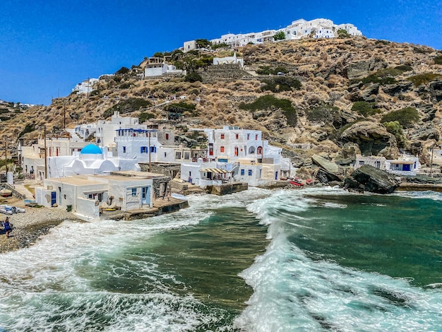 Kastro and its small Harbor waves during a sunny day Sifnos Greece