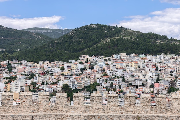 Kavala chaotic urban residential development on forested hill through the battlements of the castle