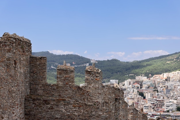 Kavala city masonry wall part survived for 7 centuries against white chaotically placed. Greece