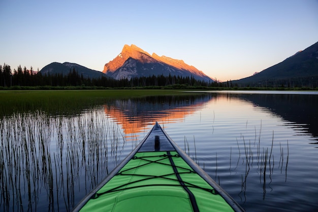 Kayaking in a lake surrounded by the Canadian Nature Landscape