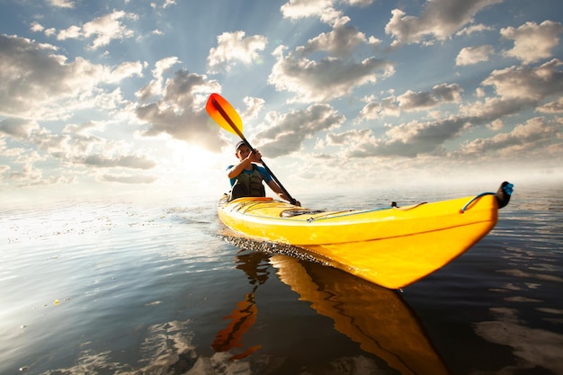 Kayaking Man paddling a kayak Canoeing paddling