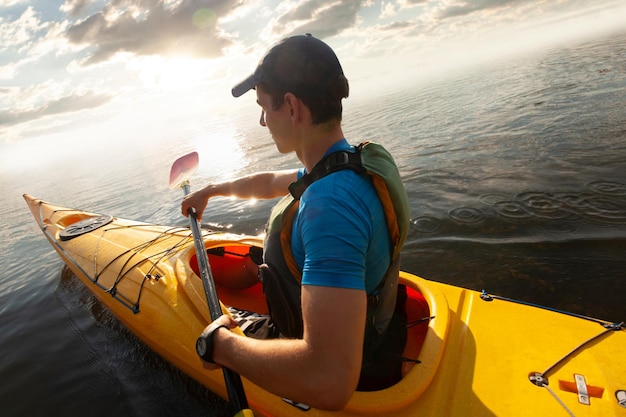 Kayaking Man paddling a kayak Canoeing paddling