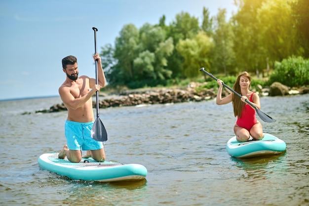 Kayaking. Two people kayaking and looking enjoyed