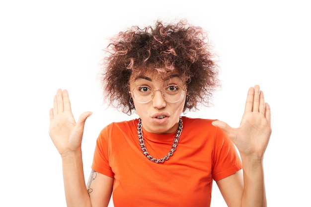 Kazakh girl with afro hairstyle shows stop gesture to violence and discrimination isolated on white background