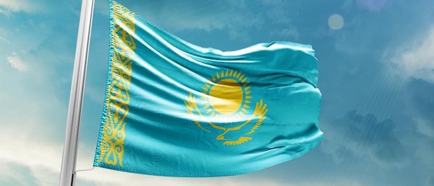 Kazakhstan national flag waving in the beautiful sky