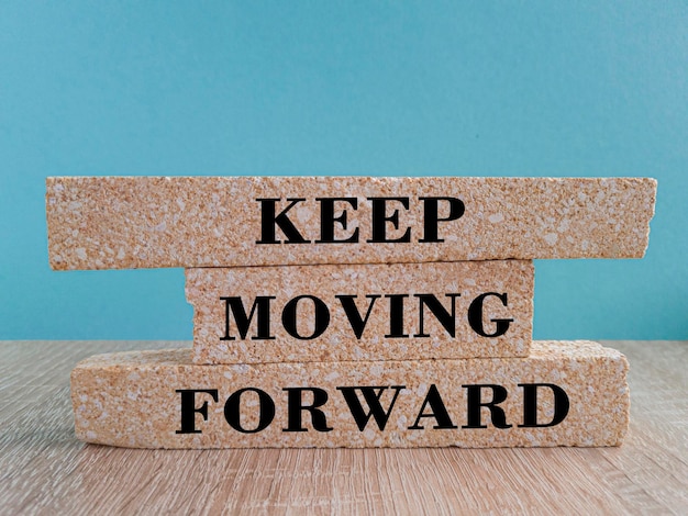 Keep moving forward symbol Concept words Keep moving forward on blocks on beautiful wooden table