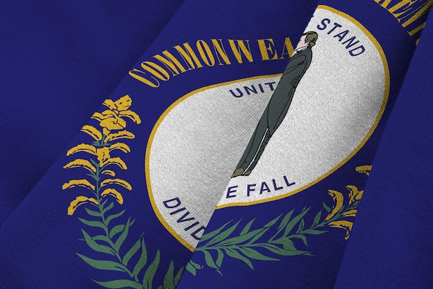 Kentucky us state flag with big folds waving close up under the studio light indoors the official sy