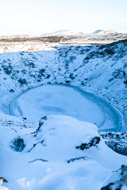 Kerid lake frozen in winter in the crater of an extinct volcano. Incredible iceland landscape in winter.