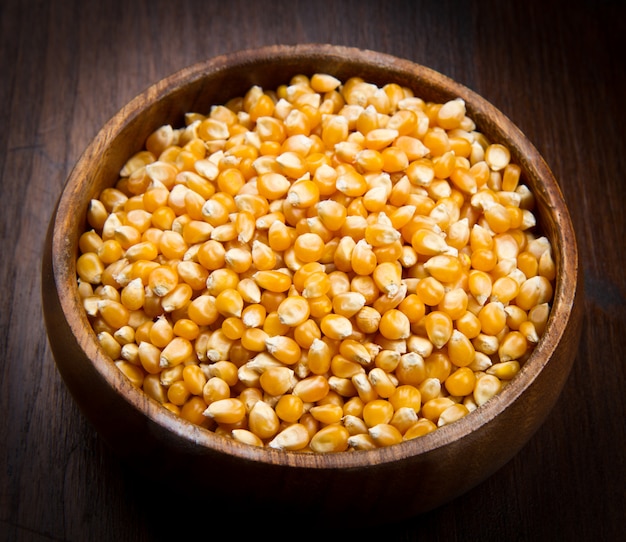 Kernels, Corn seeds on wood bowl