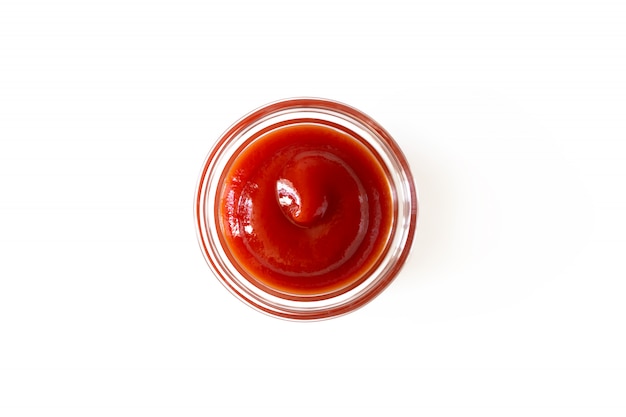 Ketchup sauce in glass bowl isolated on white background