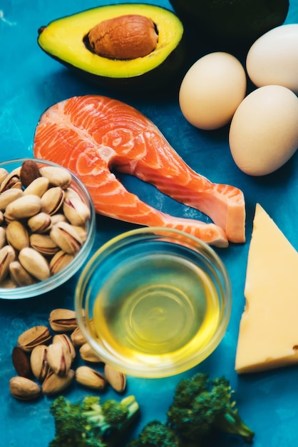 Keto diet food on blue background Selective focus