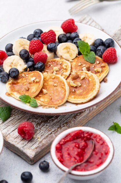 Photo keto diet pancakes made or almond flour, served with berries.