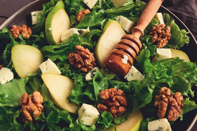 Keto Salad pear with blue cheese and walnut selective focus no people closeup